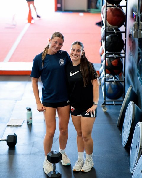 Two athletes in the gym