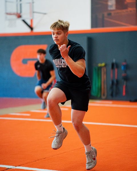 Athlete sprinting across the turf
