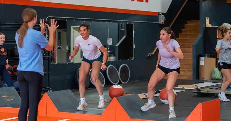 Coach leading a medicine ball session