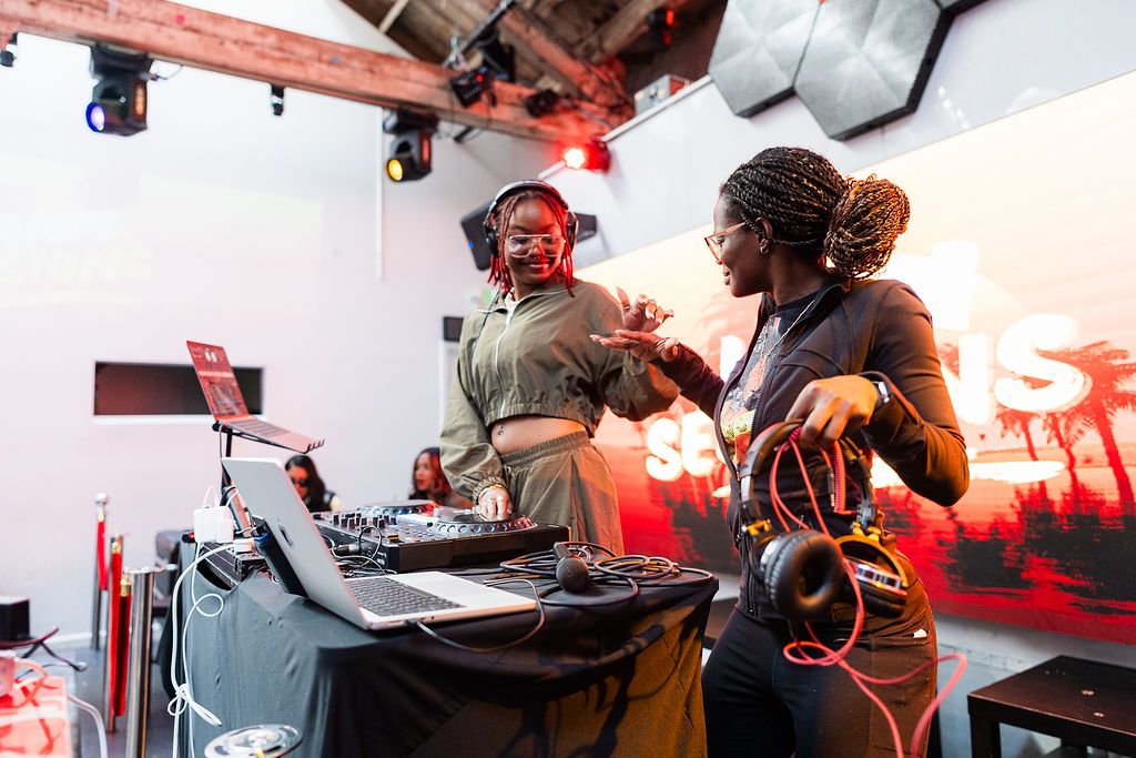 A Jahm Sessions live performance photographed close in warm stage light.