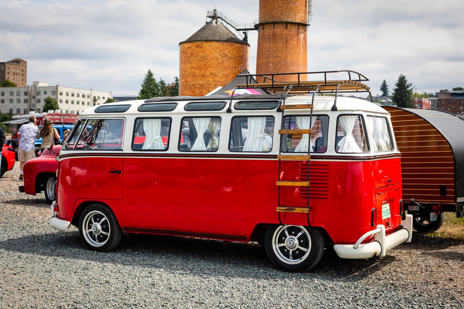 A red and white Volkswagen bus parked at the Imports and Classic Car Show in Bellingham, Washington.