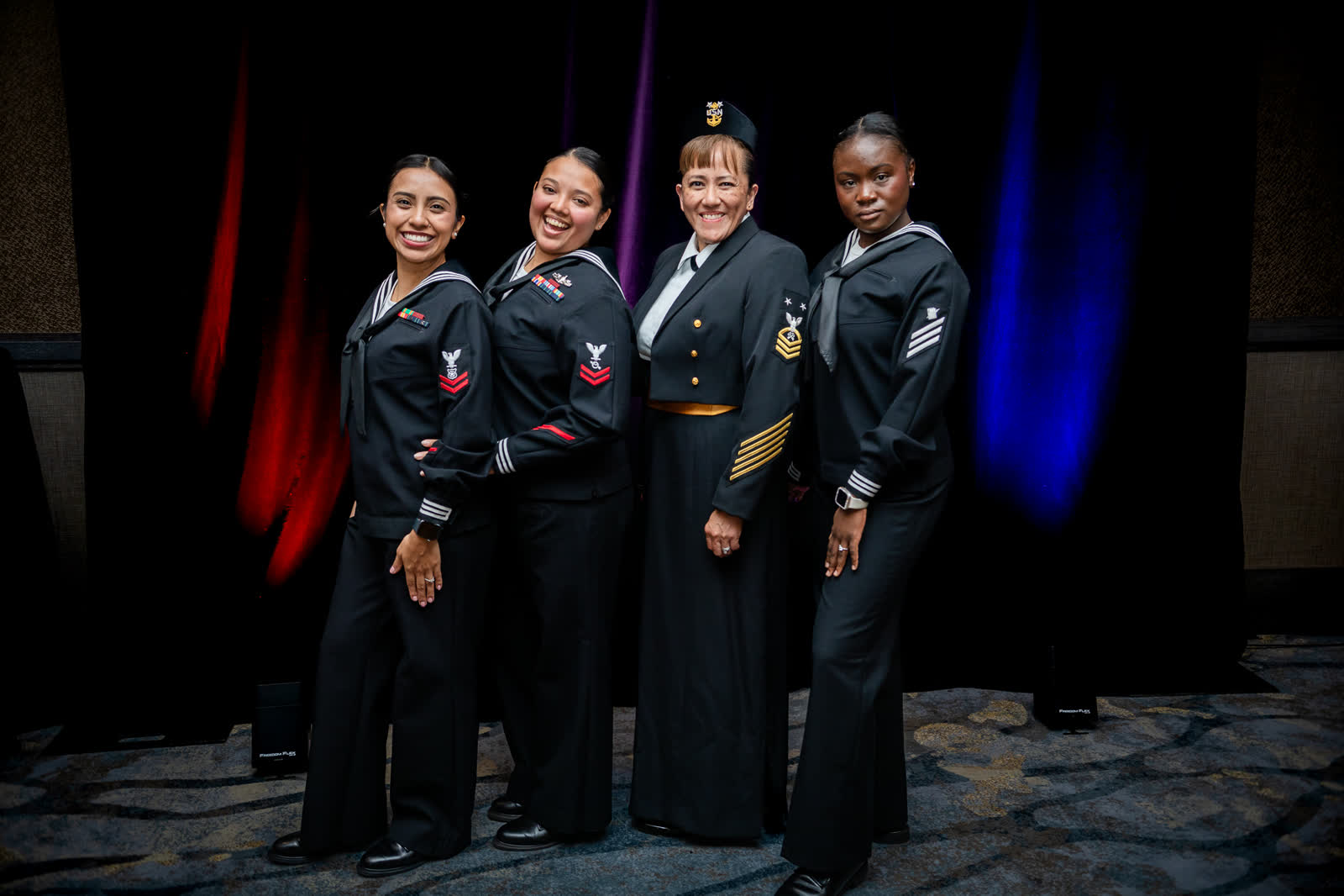 Four sailors in dress uniform photographed together at the Navy Ball in Everett, Washington.