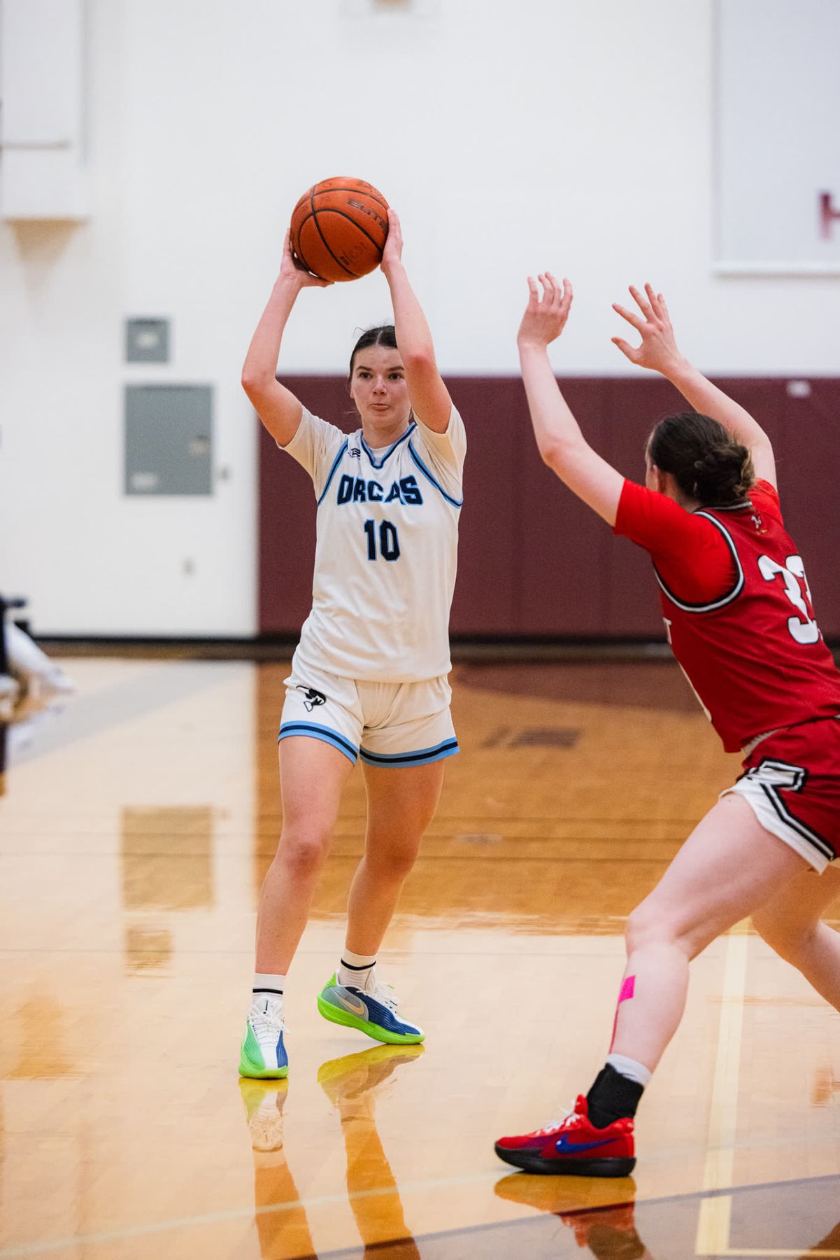 A Whatcom Community College player squares up to shoot over a defender during a home game in Bellingham.