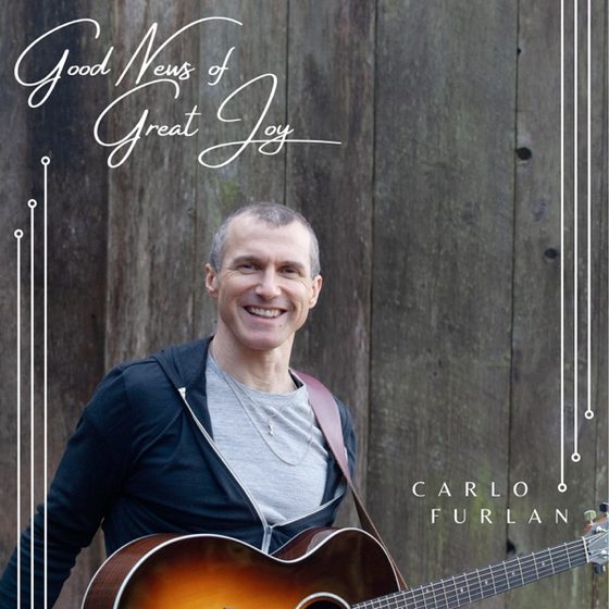 Carlo Furlan with his guitar on the cover of Good News of Great Joy