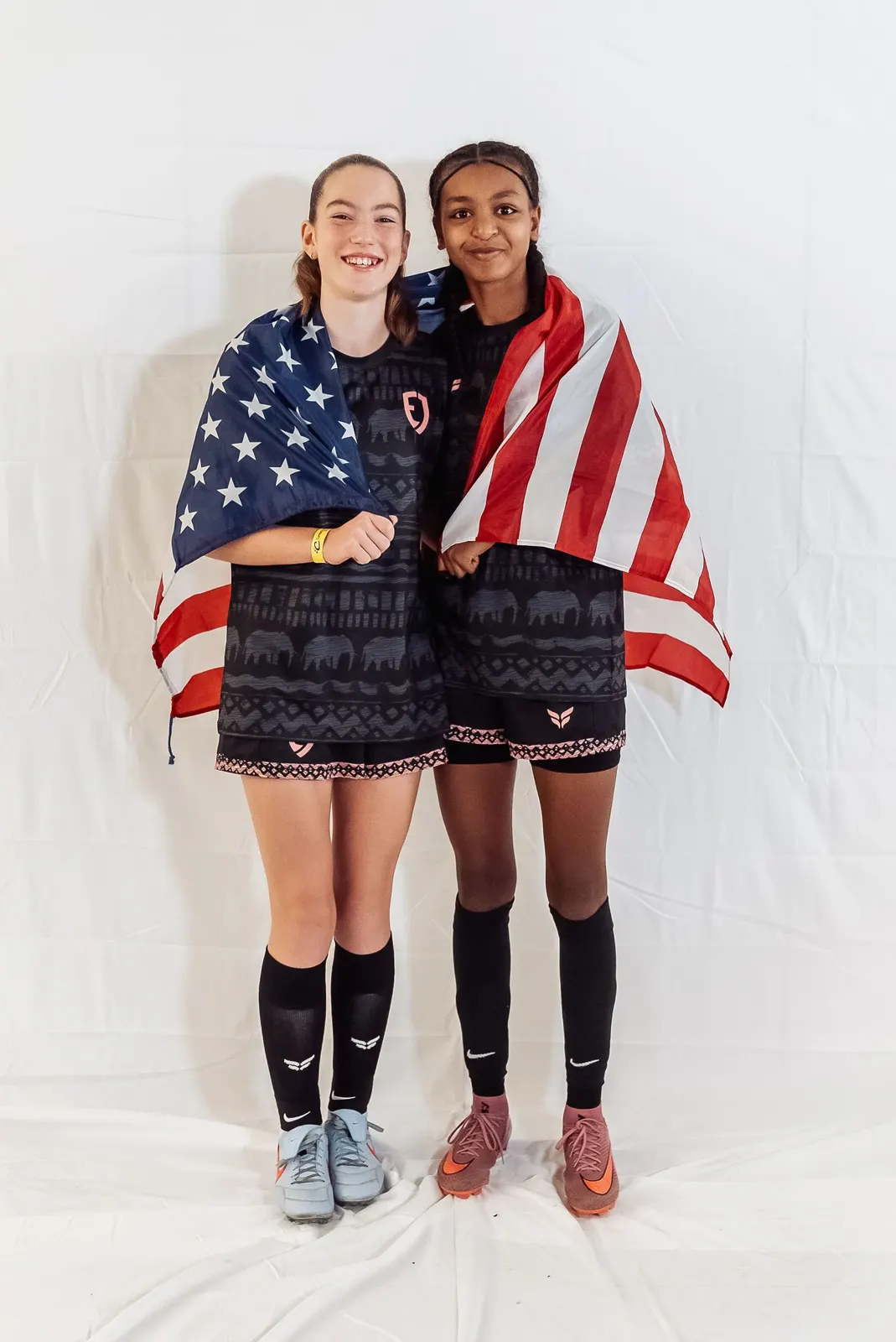 Two players with the US flag on media day